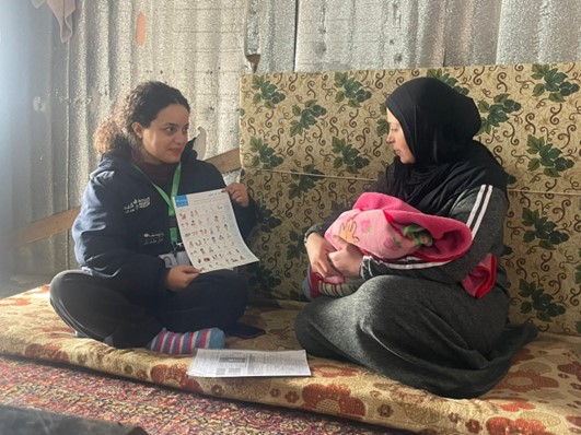 Fatima learning about Breastfeeding - Arsal - Lebanon (Julia Aridi / Action Against Hunger)